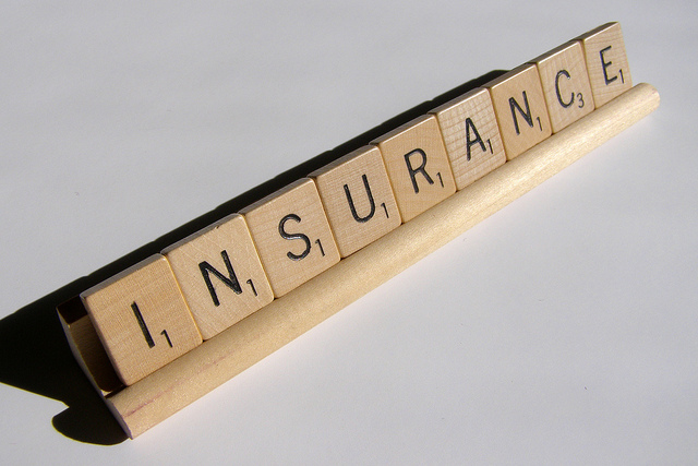 Scrabble letters spell out INSURANCE